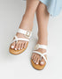 White Stravia criss-cross flats with jeweled buckle