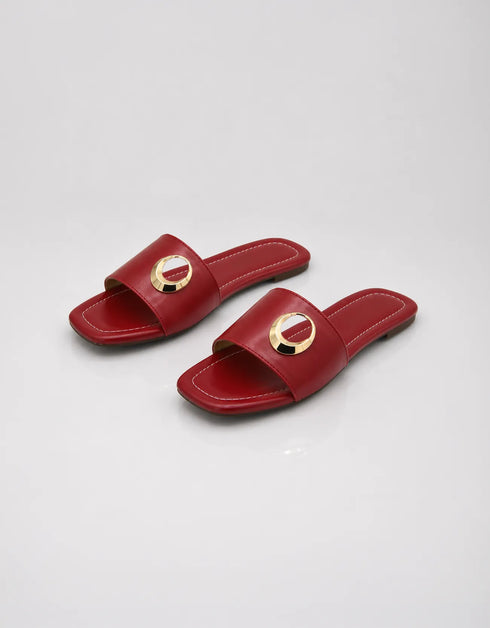 Pair of Aurelle maroon women's flat sandals with statement gold metal ring detail