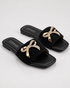 Pair of Aveen black flat sandals with embellished bow detail