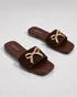 Pair of Aveen brown women's flat sandals with embellished bow detail