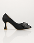 Black party wear heels for women with pointed toe silhouette and crystal bow side profile β Essence by Rubina