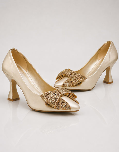 Golden pointed toe party wear heels featuring embellished crystal bow and low heel