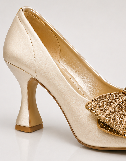 Golden pointed toe party wear heels featuring bow and low heel