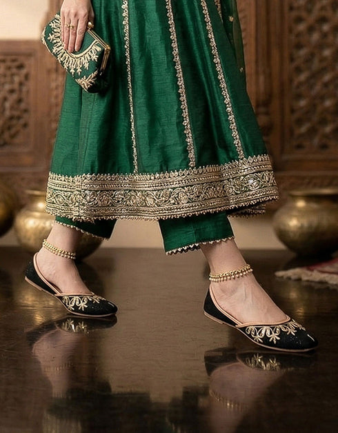 Black embroidered ladies khussa shoes paired with green outfit elegant handmade Pakistani khussa for women
