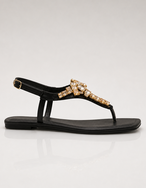 Side view of black flat T-strap sandals with crystal design, elegant women footwear for summer, durable comfortable sandals for daily wear and formal occasions