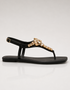 Side view of black flat T-strap sandals with crystal design, elegant women footwear for summer, durable comfortable sandals for daily wear and formal occasions