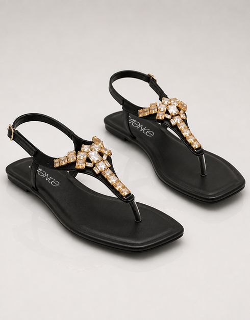 Top view of black womenβs T-strap sandals with crystal accents, minimalist flat sandals for girls, trendy summer footwear Pakistan, comfortable and stylish ladies sandals