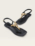 Top view of black womenβs T-strap sandals with crystal accents, minimalist flat sandals for girls, trendy summer footwear Pakistan, comfortable and stylish ladies sandals