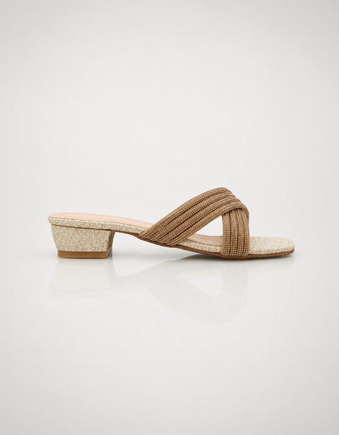 Pair of gold embellished cross strap low block heel slippers with elegant shimmer finish.