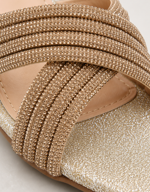 Close up of gold shimmer embellished cross straps showing premium detailing.