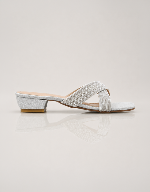 Silver embellished low block heel slippers for women with elegant cross strap design and soft padded comfort.