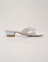 Silver embellished low block heel slippers for women with elegant cross strap design and soft padded comfort.