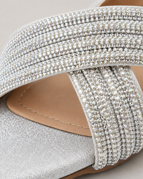 Close up of silver shimmer embellished cross straps showing premium craftsmanship.