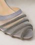 Close up of embellished shimmer straps on Zareenah silver block heel sandals
