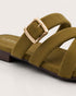 Close up of olive cross strap sandals highlighting the statement buckle and premium craftsmanship.
