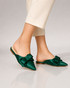 Model wearing green pointed toe flat mules for women