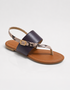 Brown flat sandals for women featuring a textured strap and comfortable sole