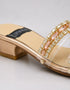 Close up of the statement stone buckle on Gilda luxury gold block heel showcasing the embellished craftsmanship.