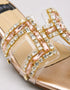 Gilda luxury gold block heels paired with a formal outfit for elegant occasion wear.