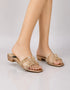 Model wearing Gilda luxury gold block heels styled for weddings, parties, and special occasions.