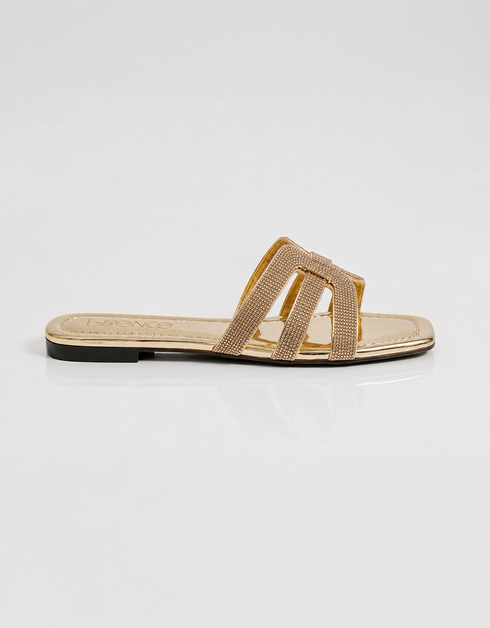 Side view of gold shimmer flat sandals featuring a lightweight slip on design and sleek multi straps.