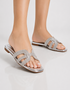 Model wearing silver shimmer flat sandals styled with casual and festive outfits.