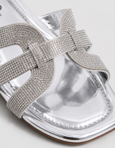 Close up of silver shimmer flat sandals showcasing the premium textured multi strap finish.