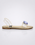 Side view of gold flat sandal with rhinestone embellishment for women