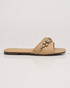 Side view of beige crystal embellished flat sandals featuring a lightweight slip on silhouette.