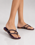Woman wearing purple embellished flat sandals casual and festive styling