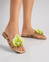 Model wearing beige floral flat sandals styled for everyday summer outfits.