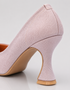 Close up of Lusture pink shimmer pumps highlighting the sparkling finish and premium craftsmanship.