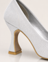 Pair of Lusture silver shimmer pumps with pointed toe silhouette and comfortable mid heel.