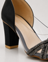 Close up of black shimmer embellished straps with transparent upper showing premium craftsmanship.