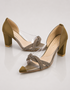 Pair of olive transparent block heel sandals with shimmering crossover straps and block heel.