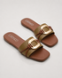 Pair of olive green buckle flat sandals featuring a statement metallic buckle and padded footbed.