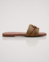 Side view of olive green buckle flat sandals with lightweight slip on construction.