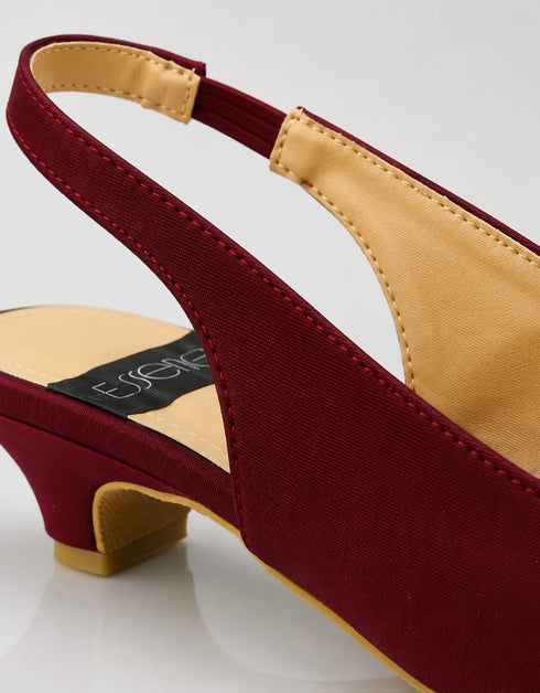 Close up of the statement bow detail on Marcelle burgundy bow slingback pumps crafted from premium textile fabric.
