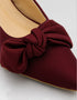 Marcelle burgundy bow slingback pumps paired with a smart casual outfit for an elegant everyday look.