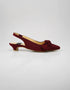 Side profile of Marcelle burgundy bow slingback pumps highlighting the low heel, slingback strap, and pointed toe design.