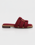 Side view of red multi strap flat sandals featuring a lightweight slip on design.