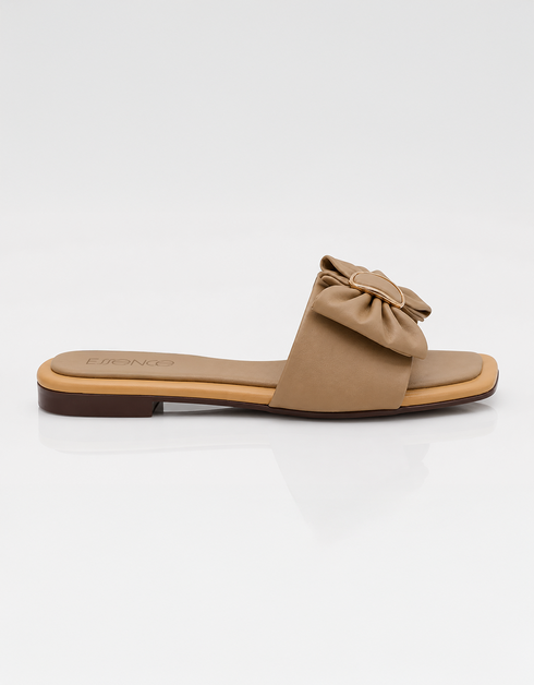 Side view of beige bow flat sandals featuring a square toe and lightweight slip on design.