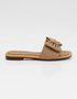 Side view of beige bow flat sandals featuring a square toe and lightweight slip on design.