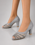 Model wearing Zareenah silver shimmer block heel sandals for women