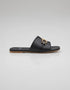 Side profile of Nova Chic Comfort Flat Sandals in Black showing the slip on design, gold metal buckle, and cushioned footbed.