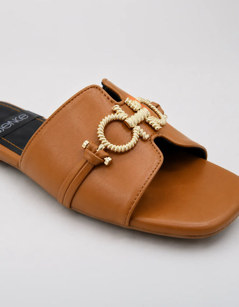 Close up of the gold metal buckle on Nova Chic Comfort Flat Sandals in Brown highlighting the premium finish.
