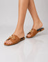 Model wearing Nova Chic Comfort Flat Sandals in Brown for everyday comfort and effortless style.