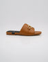 Side profile of Nova Chic Comfort Flat Sandals in Brown showing the slip on design and elegant buckle detail.