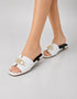 Model wearing Nova Chic Comfort Flat Sandals in White for a modern everyday look.
