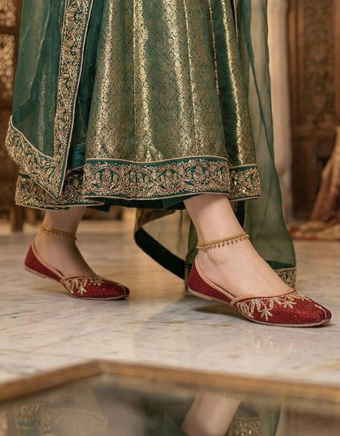 view of red handmade ladies khussa shoes traditional embroidered jutti for festive and casual wear